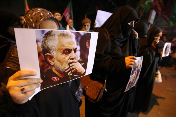 epa08100430 Pakistani Shiite Muslims hold pictures of General Qasem Soleimani, the head of Iran's Islamic Revolutionary Guard Corps' elite Quds Force, during a protest against the USA, in Karachi, Pakistan, 03 January 2020. General Qasem Soleimani was killed in an airstrike in Baghdad on 03 January, ordered by the United States' president, the Pentagon said. General Soleimani was in charge of Iran's foreign policy strategy as the head of the Quds Force, an elite wing of the Islamic Revolutionary Guard Corps, which the US designated as a terror organization. The Quds Force holds sway over a raft of Shia militias across the region, from Lebanon to Syria and Iraq.  EPA/SHAHZAIB AKBER