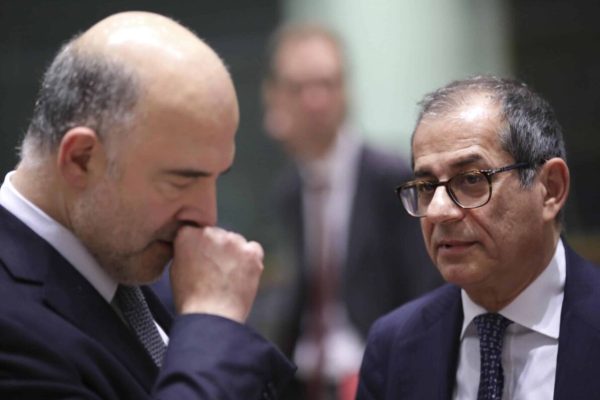 Italian Finance Minister Giovanni Tria, right, speaks with European Commissioner for Economic and Financial Affairs Pierre Moscovici during a round table meeting of eurogroup finance ministers at the Europa building in Brussels, Monday, Dec. 3, 2018. (ANSA/AP Photo/Olivier Matthys) [CopyrightNotice: Copyright 2018 The Associated Press. All rights reserved]