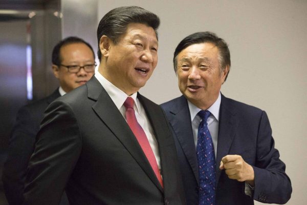 epa04987535 Xi Jinping, China's President, (L), reacts as he is shown around the offices of Huawei Technologies Co Ltd. by Ren Zhengfei (R), billionaire and president of Huawei Technologies Co., at their offices in London, England, 21 October 2015. Britain's Prime Minister David Cameron said Xi will bring more than 30 billion GBP or 46 billion US dollars in deals and investment on his visit to Britain this week, as the prime minister defended himself against charges he was being too warm towards his visitor. P  EPA/MATTHEW LLOYD / POOL
