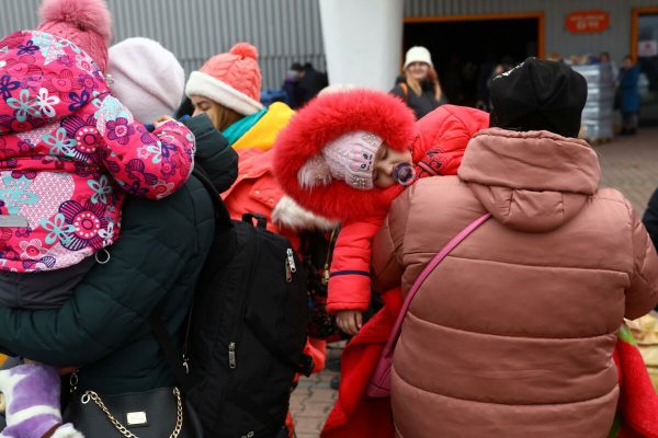 epa09812730 Ukrainian refugees at the Humanitarian Aid Center at the Ptak Warsaw Expo in Nadarzyn, near Warsaw, Poland, 09 March 2022. About 200,000 Ukrainian war refugees have reached Warsaw since Russia invaded Ukraine on 24 February,  the governor of the Mazowieckie province, said on 09 March.  EPA/Rafal Guz POLAND OUT