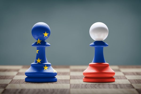 European,Union,And,Russia,Conflict.,Flags,On,Chess,Pawns,On