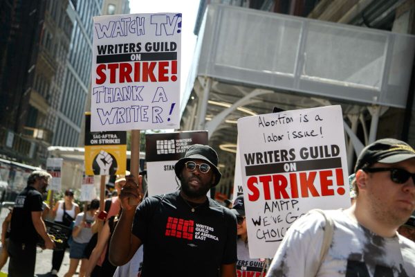 epa10792079 People picket on the 100th day of the Writers Guild of America (WGA) strike outside of Warner Bros. Discovery and the Netflix headquarters in New York, New York USA, 09 August 2023. Television networks and movie studios are still unable to agree on proposed pay raises and changes to the industrys business model.  EPA/SARAH YENESEL