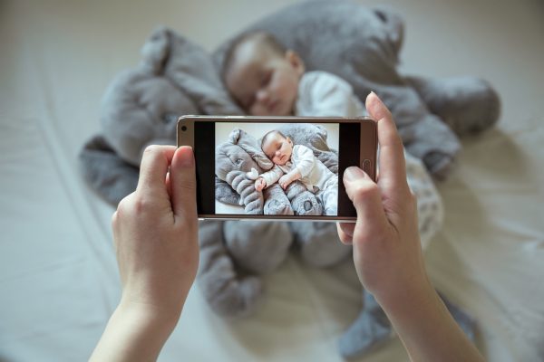 Mother,Shootin,Her,Sleeping,Newborn,Baby,By,Smartphone