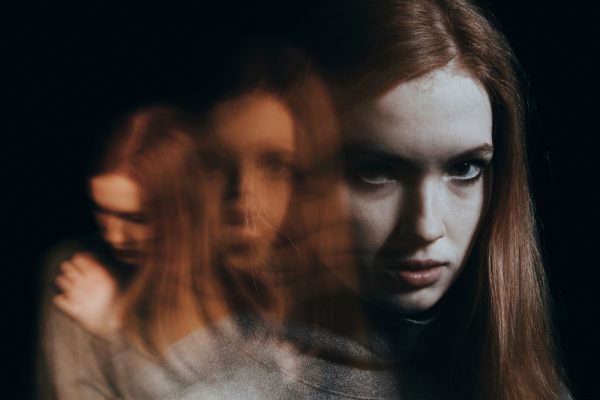 Blurred,Figures,Of,A,Red-haired,Girl.,Concept,Of,Mental,Illness