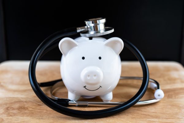 Piggy,Bank,With,Stethoscope,,Check,Health,Savings,Regularly,Concept.
