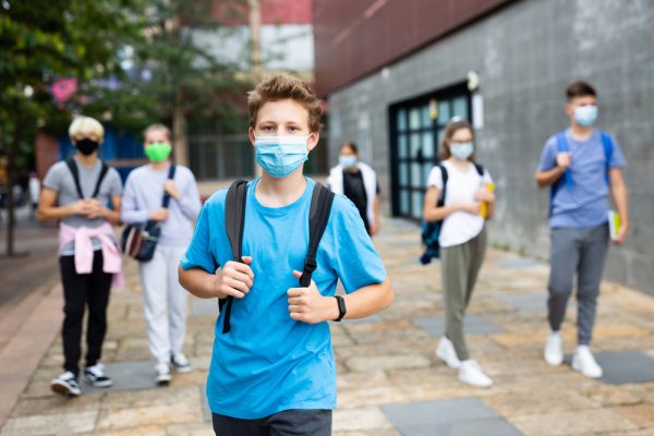 Portrait,Of,Teenager,In,Protective,Mask,With,Backpack,Going,To