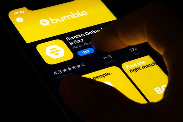 Hand,Holding,A,Smartphone,With,A,Bumble,Dating,App,On