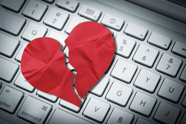 Red,Heart,Paper,On,Keyboard,Computer,Background.,Online,Internet,Romance