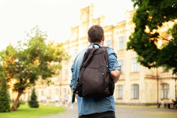 Student,University,Standing,With,His,Back,To,The,Camera,And