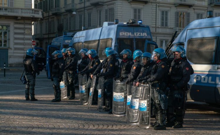 Italian,Police,Officers,,In,Riot,Gear,,Lined,Up,Against,A
