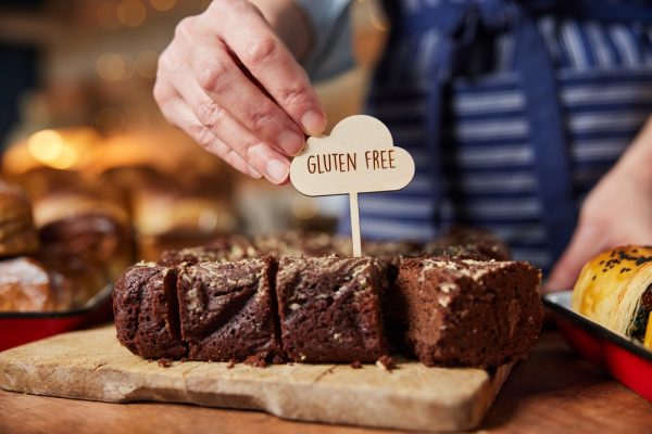 Sales,Assistant,In,Bakery,Putting,Gluten,Free,Label,Into,Freshly