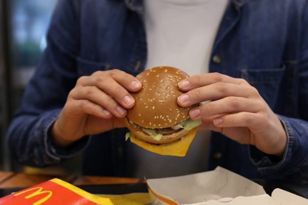 Lviv,,Ukraine,-,October,9,,2023:,Woman,With,Mcdonald's,Burger