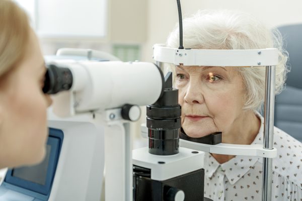 Young,Female,Ophthalmologist,Using,Apparatus