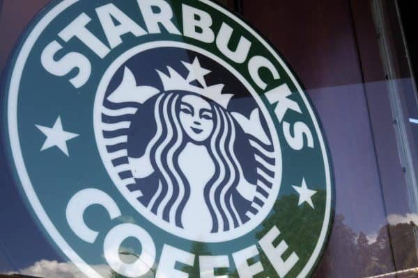 epa06680565 Starbucks signage in front of the store's window in Oakland, California, USA, 19 April 2018.  Starbucks will be closing 8,000 stores in late May for several hours across the United States to conduct racial-bias training for workers after Starbucks Corp. issued an apology following the arrest of two black men at a store in Philadelphia, Pennsylvania.  EPA/JOHN G. MABANGLO