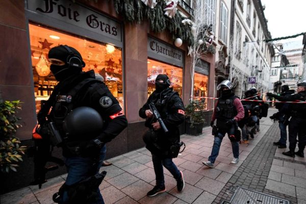 epa07225138 Members of the French National Police BRI (Research and Intervention Brigade) during their search for a suspect following a deadly shooting that took place at a Christmas market in Strasbourg, France, 12 December 2018. According to reports, three people were killed and 12 others were wounded after a gunman opened fire at a popular Christmas market in Strasbourg on 11 December evening. Hundreds of police officers are hunting the suspect, who is at large and said to be known to security services. The motive of the attack is yet unclear.  EPA/PATRICK SEEGER