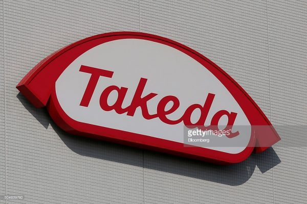 The Takeda Pharmaceutical Co. logo is displayed at it's Shonan Research Center in Fujisawa, Kanagawa Prefecture, Japan, on Tuesday, Dec. 15, 2015. With about 1.78 trillion yen ($15 billion) in annual revenue, Takeda ranks 18th among the 20 largest pharma companies worldwide. Photographer: Yuriko Nakao/Bloomberg