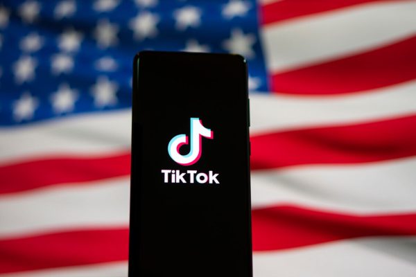 Tiktok,Logo,On,Phone,With,America,Flag,Background.,Bangkok,,Thailand