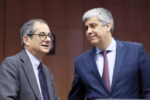 epa07306576 Italian Minister of Economy and Finance Giovanni Tria and Eurogroup President Portuguese Finance Minister Mario Centeno (R) talk during Eurogroup Finance Ministers' meeting in Brussels, Belgium, 21 January 2019.  EPA/OLIVIER HOSLET