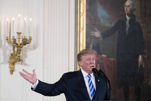 epa06547706 US President Donald J. Trump delivers remarks during a Public Safety Medal of Valor Awards Ceremony in the East Room of the White House in Washington, DC, USA, 20 February 2018. During his remarks President Trump announced he signed a directive ordering Attorney General Jeff Sessions to craft regulations banning "bump stocks" and other devices that turn semi-automatic firearms into automatic weapons.  EPA/SHAWN THEW