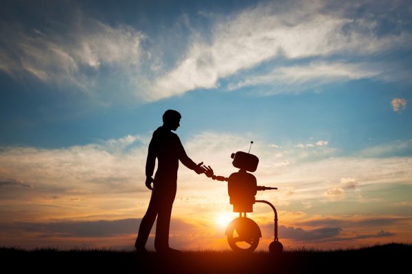 Man,And,Robot,Meet,And,Handshake.,Concept,Of,The,Future