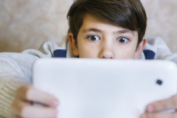 Boy,With,Pad,Playing,Game
