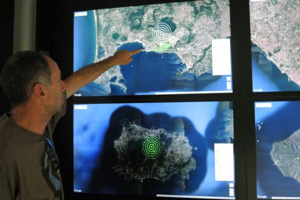 Geologist Roberto Isaia points at satellite photos of the Gulf of Naples at the volcano observatory of the National Institute for Geophysics and Volcanology (INGV) in Naples, Italy, 16 June 2017. The Phlegraean Fields cover roughly 150 square kilometers and known for a high volcanic activity. Vulcanologists currently register an increased activity, the alarm level yellow has been current since 2012. Photo: Lena Klimkeit/dpa