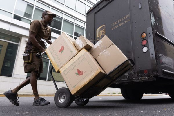 epa10904019 A UPS truck driver unloads boxes from a truck onto a dolly in Washington, DC, USA, 06 October 2023. The United States economy added 336,000 jobs in September 2023, according to a new jobs report - which far exceeded expectations. The Dow gained three hundred points after the jobs report was released by the Bureau of Labor Statistics. Unemployment in the US has now remained under four percent for the longest stretch since the 1960s.  EPA/MICHAEL REYNOLDS