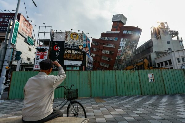 epa11257926 An elderly man looks at a partially collapsed residential building following the 03 April magnitude 7.4 earthquake in Hualien, Taiwan, 04 April 2024. According to data released by Taiwan's National Fire Agency, the earthquake has taken at least nine lives and injured hundreds, making it the strongest earthquake in 25 years.  EPA/DANIEL CENG